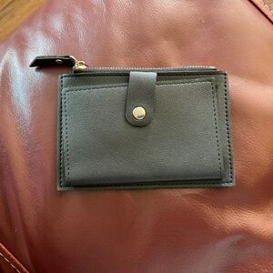 Small black wallet, one zipper, no defects, unbranded, with card holders